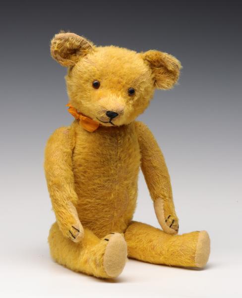 A GOOD 21-INCH GOLD MOHAIR TEDDY