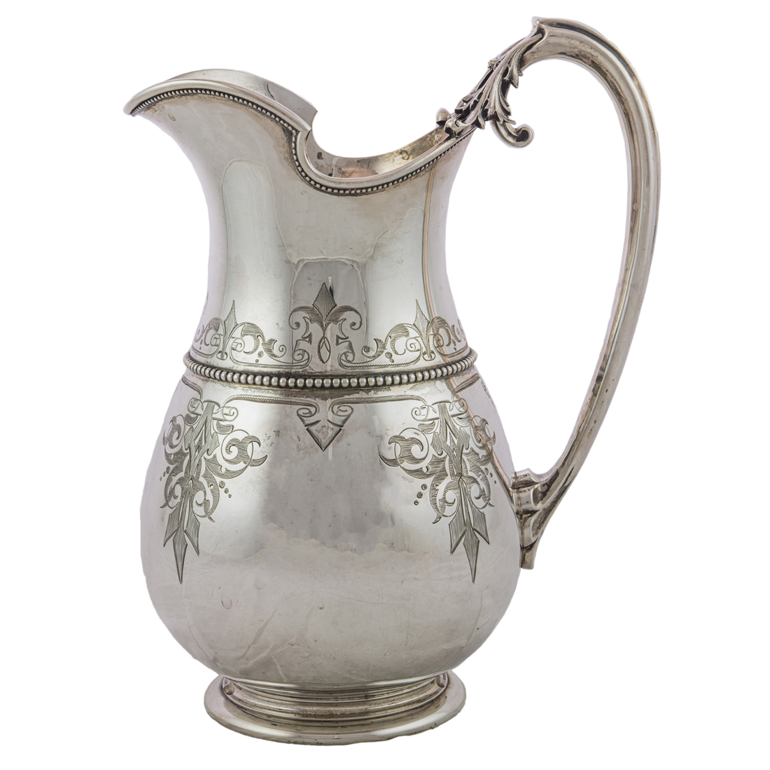 A GORHAM SILVER HELMET PITCHER,