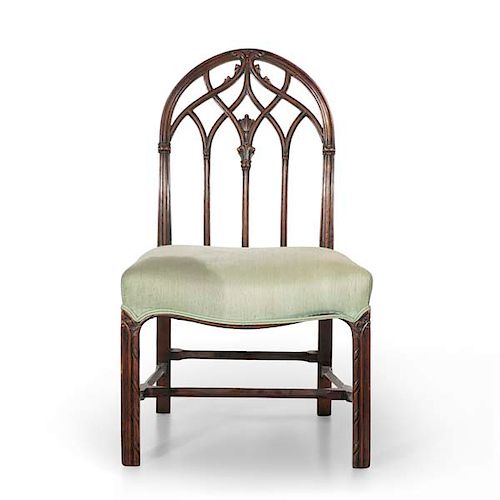 A GOTHIC REVIVAL CARVED MAHOGANY