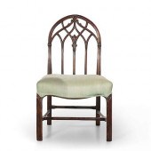 A GOTHIC REVIVAL CARVED MAHOGA