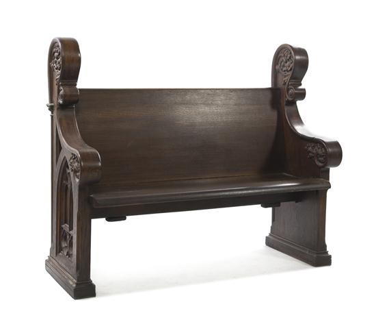 * A Gothic Revival Oak Pew having