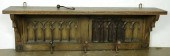 A GOTHIC REVIVAL OAK COAT RACK