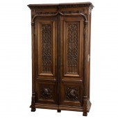 A GOTHIC REVIVAL WALNUT CABINE