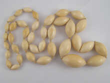 A graduated ivory bead necklace