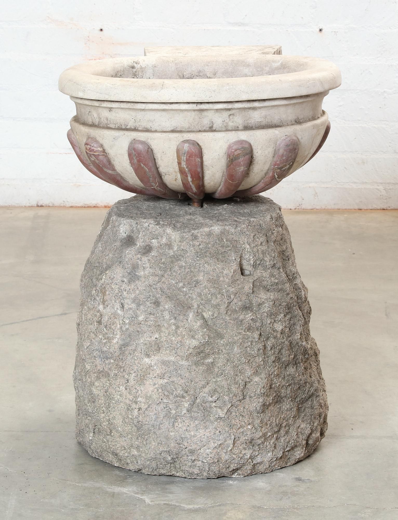 A GRANITE FOUNTAIN BASE AND A