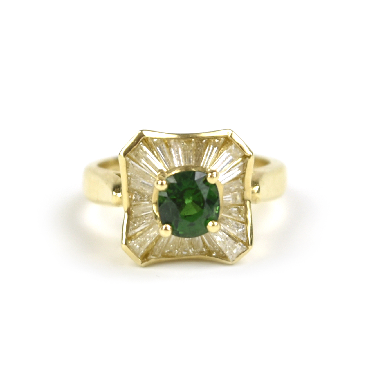 A GREEN EMERALD RING WITH