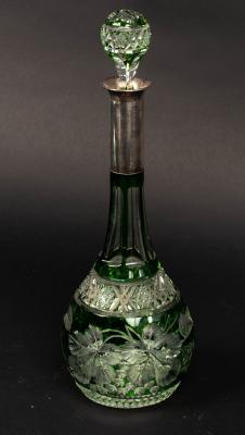A green flash cut glass decanter