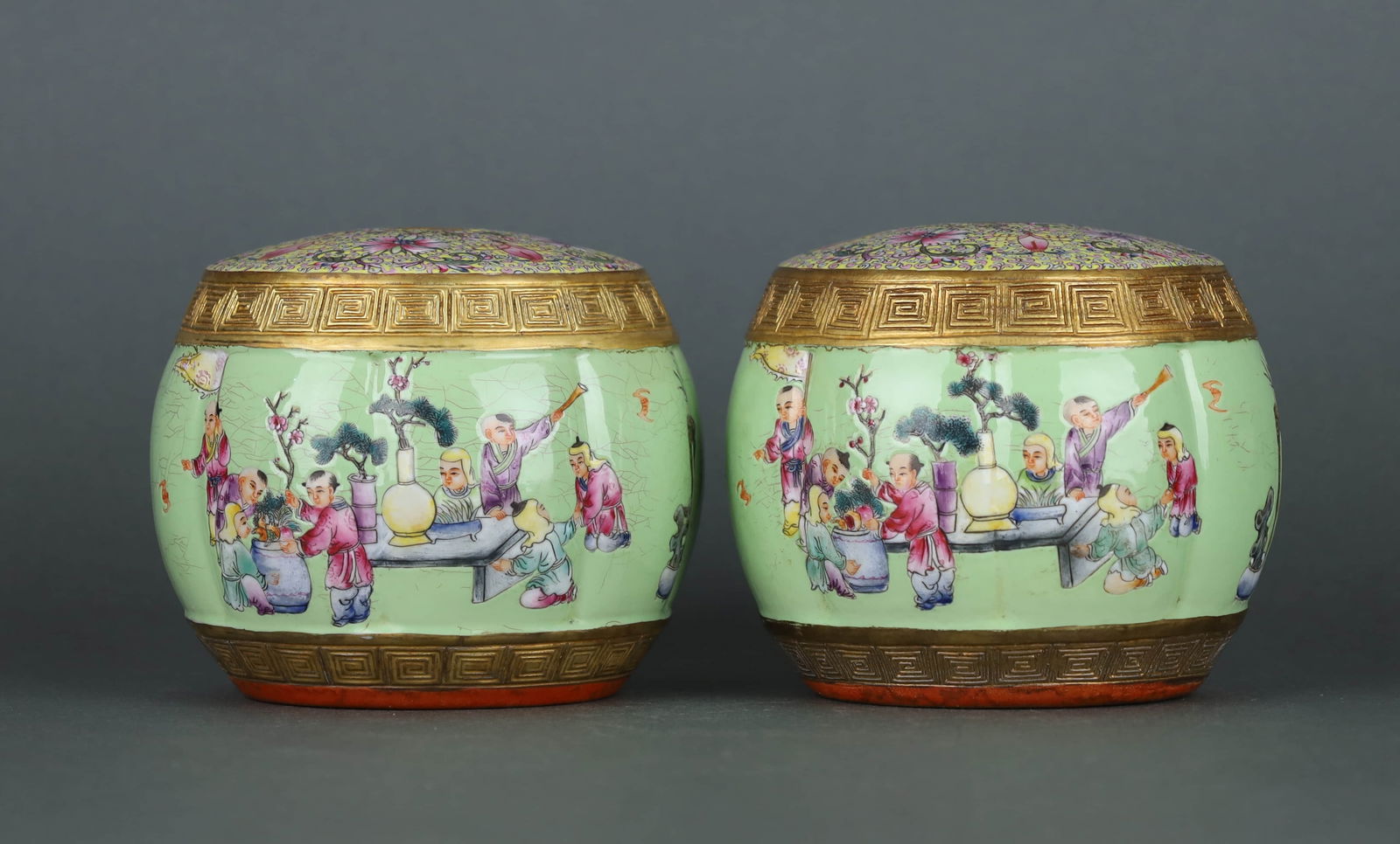 A GREEN-GROUND CARVED FAMILLE