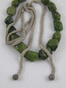 A green hard stone necklace approx.