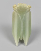 A GREEN JADEITE CICADA CARVING