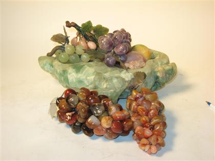 A Green quartz bowl with fruit   