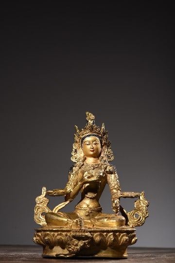 A GREEN TARA STATUEA GREEN TARA