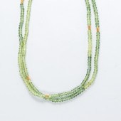 A GREEN TOURMALINE AND EIGHTEE