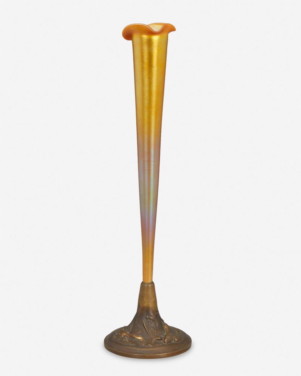 A GRIFFOUL PATINATED BRONZE AND ART