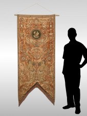 A GROTESQUE HANGING BANNER WIT