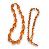 A GROUP OF AMBER NECKLACES A g