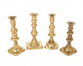 A GROUP OF BRASS CANDLESTICKSA