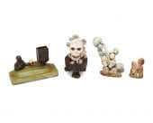 A GROUP OF CARVED BONE SKULL F