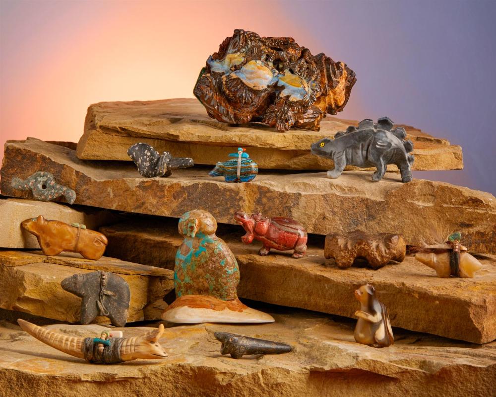 A GROUP OF CARVED STONE FIGURAL