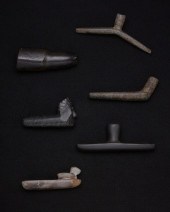 A GROUP OF CARVED STONE PIPESA