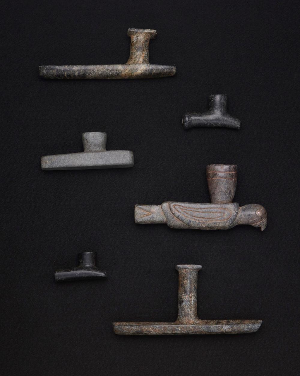 A GROUP OF CARVED STONE PIPESA