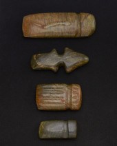 A GROUP OF CARVED STONE AXESA
