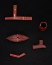 A GROUP OF CATLINITE CARVED ST