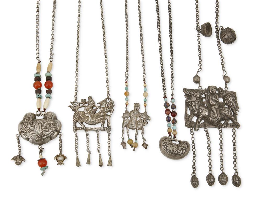 A GROUP OF CHINESE SILVER PENDANTSA