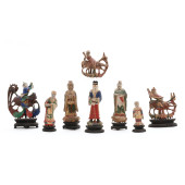 A GROUP OF EIGHT CHINESE CARVE