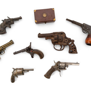 A Group of Eight Miniature Firearms