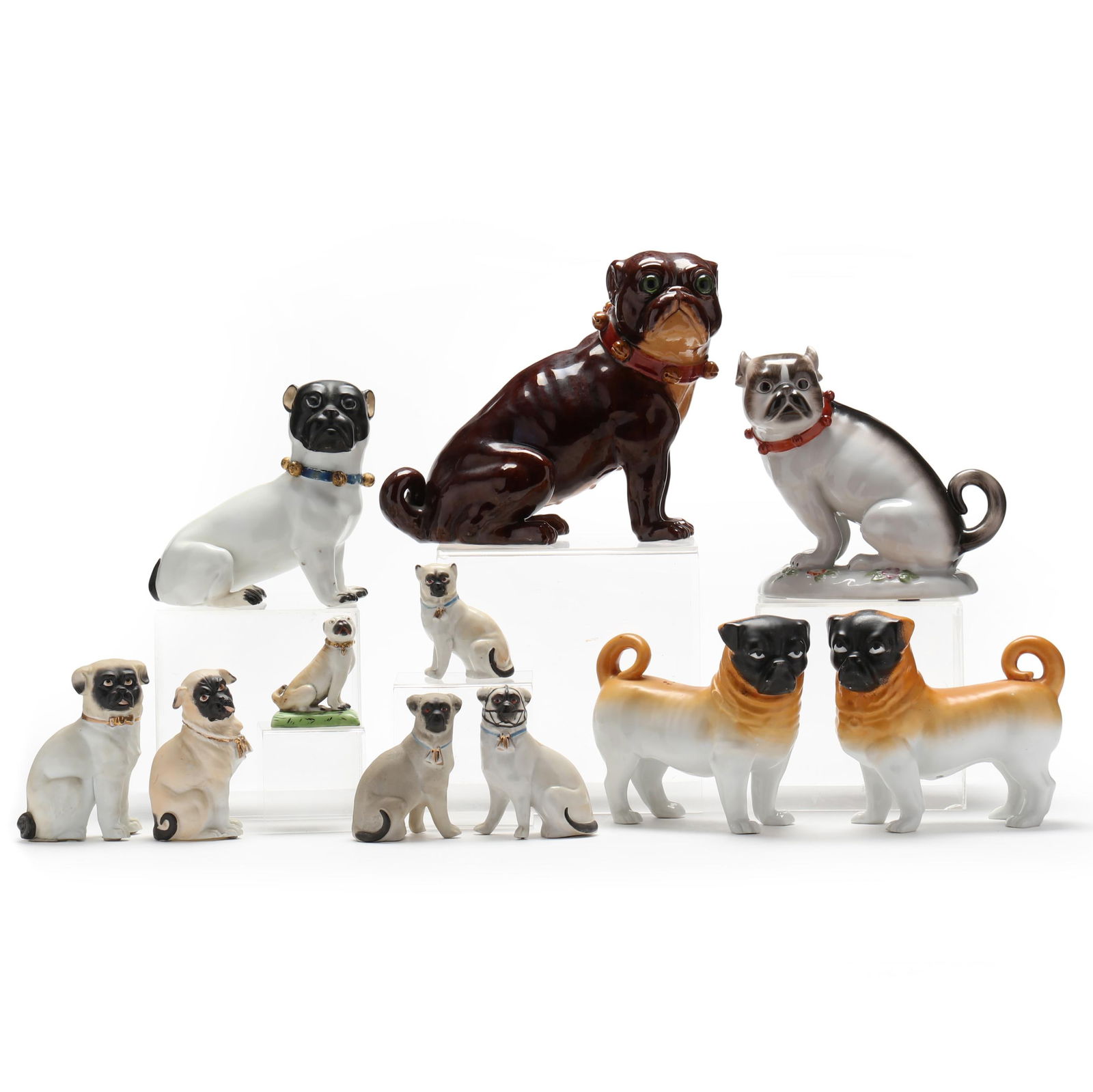 A GROUP OF ELEVEN CERAMIC PUG DOGSA