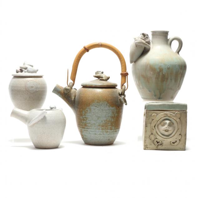 A GROUP OF FIVE PIECES BY TOM