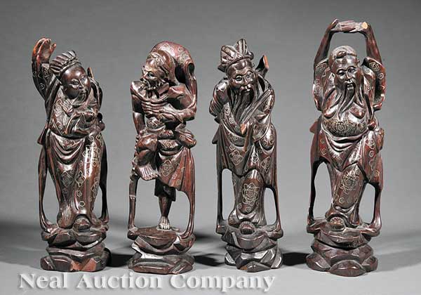 A Group of Four Chinese Carved Wood