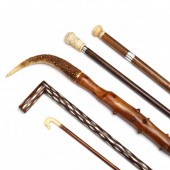 A GROUP OF FOUR HANDLED CANES