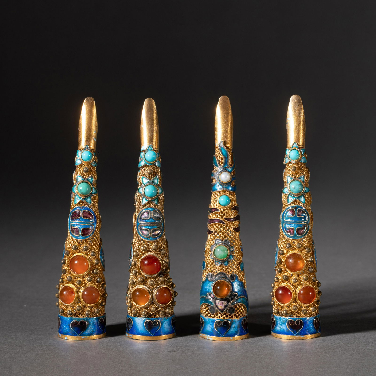 A GROUP OF FOUR HARDSTONES INLAID