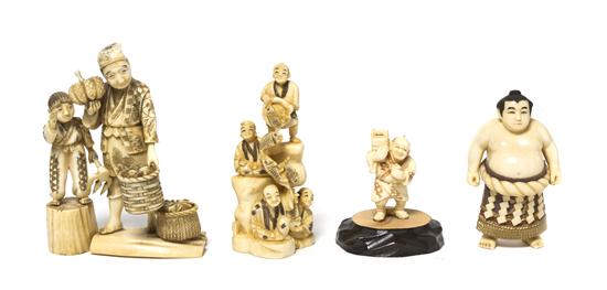 A Group of Four Japanese Carved