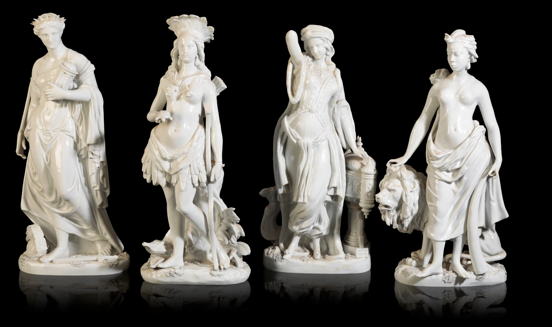 A GROUP OF FOUR WHITE-GLAZED