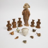 A Group of Fourteen Glazed Pot
