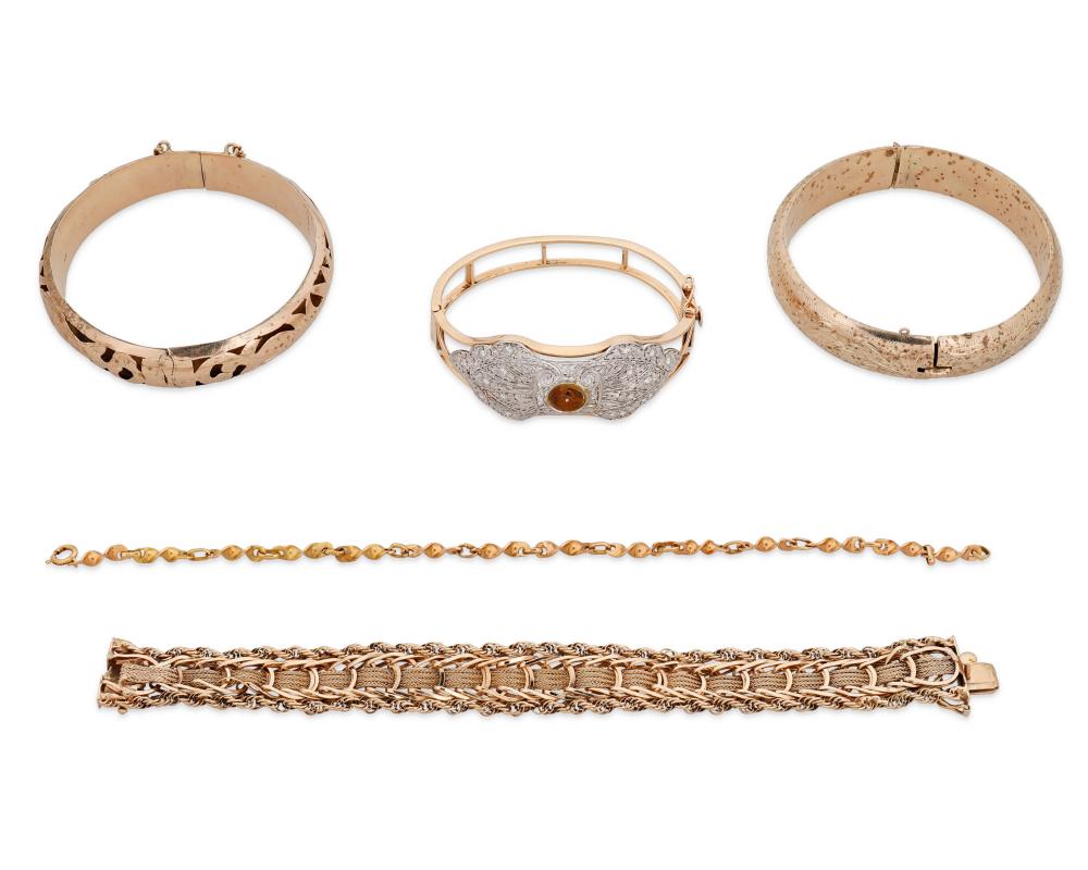 A GROUP OF GOLD BRACELETSA group of