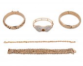 A GROUP OF GOLD BRACELETSA gro