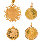 A GROUP OF GOLD COIN PENDANTS<