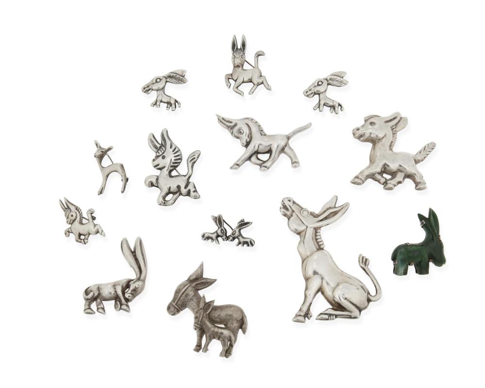 A GROUP OF MEXICAN DONKEY BROOCHESA