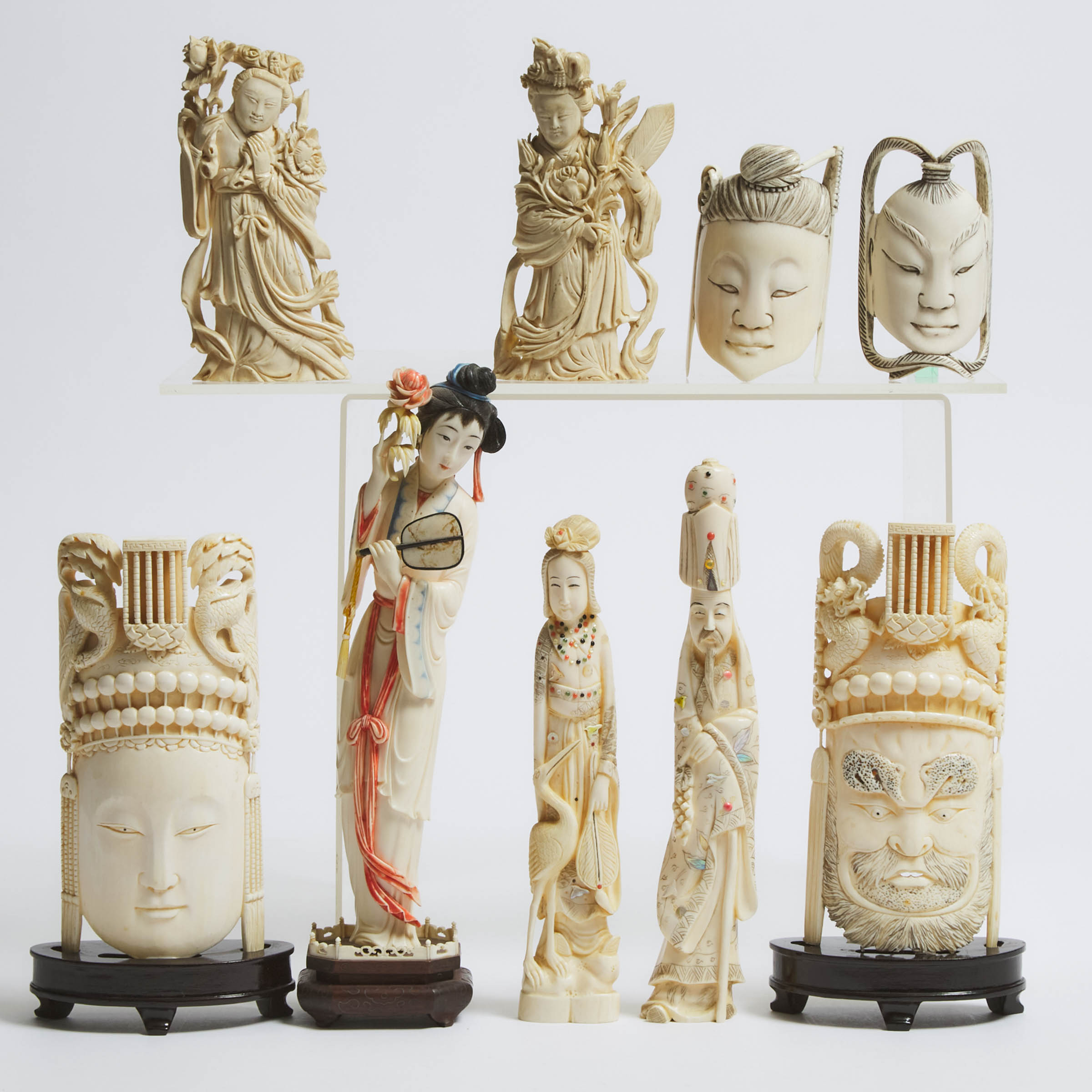 A Group of Nine Ivory Figures,