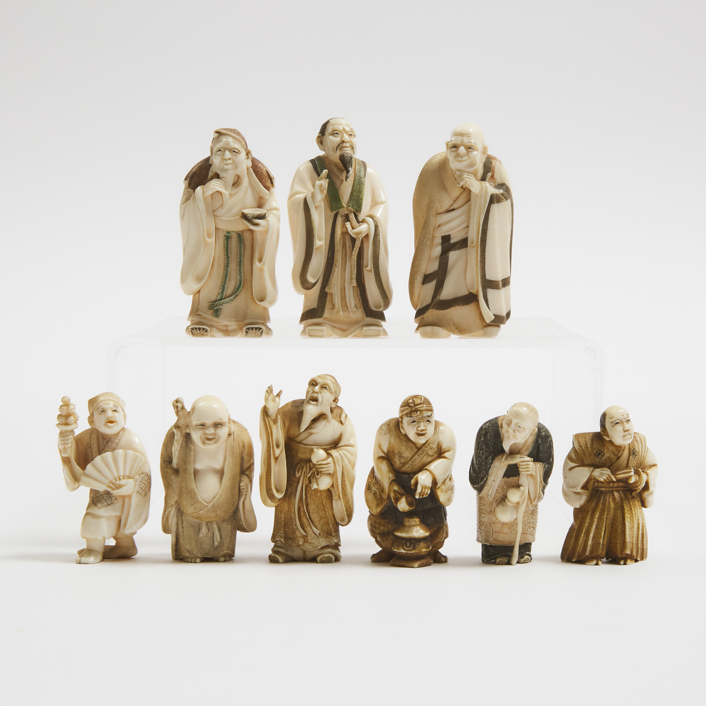 A Group of Nine Small Ivory Figural