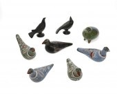 A GROUP OF POTTERY BIRD FIGURE
