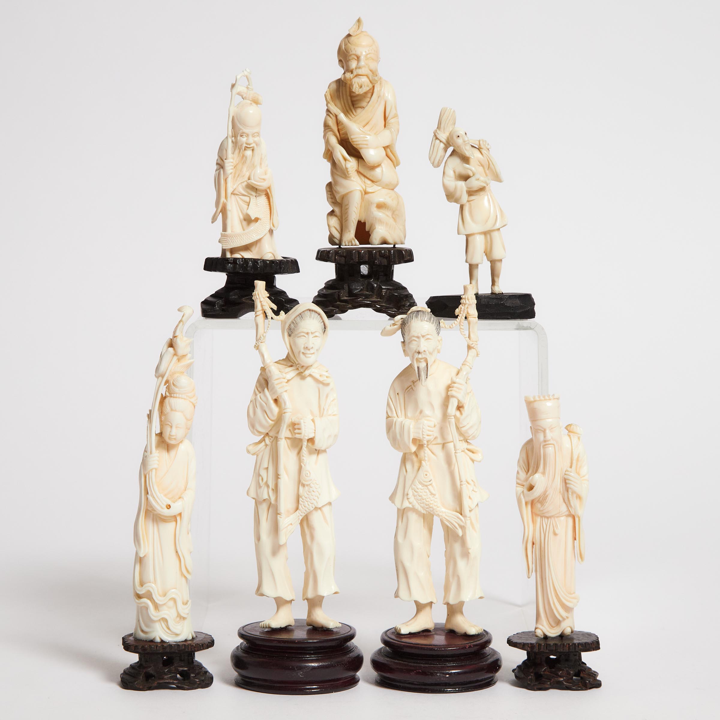 A Group of Seven Ivory Figures,