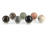 A GROUP OF SEVEN MARBLE SPHERE