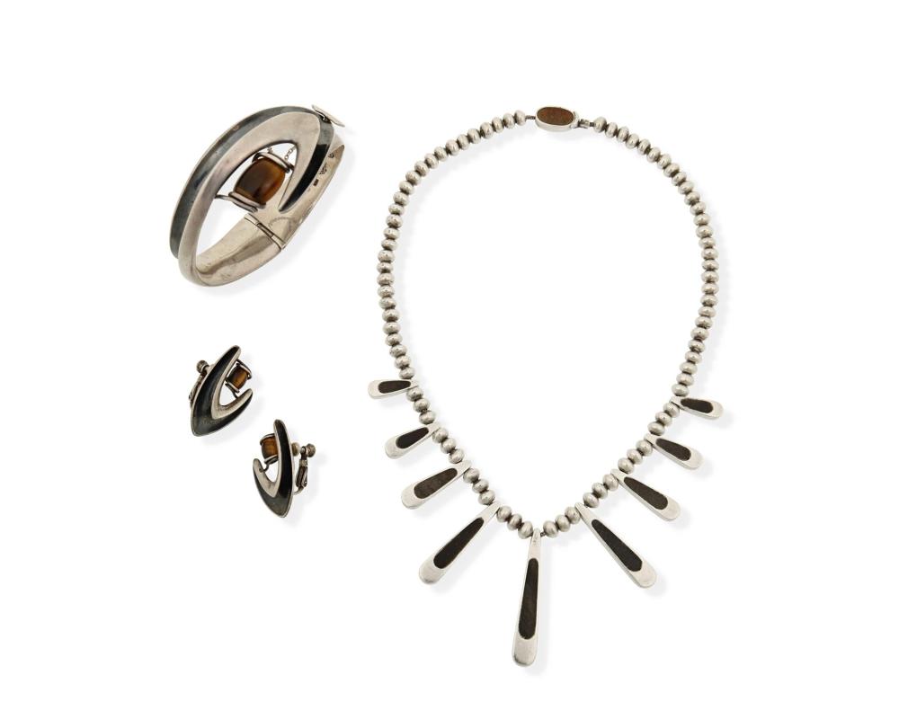 A GROUP OF SIGI SILVER, ENAMEL, AND