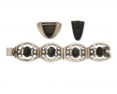 A GROUP OF SILVER AND OBSIDIAN