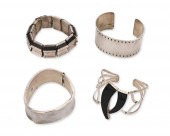 A GROUP OF SILVER BRACELETSA g
